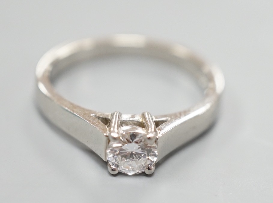 A modern platinum and solitaire diamond ring, size M, gross weight 5.2 grams